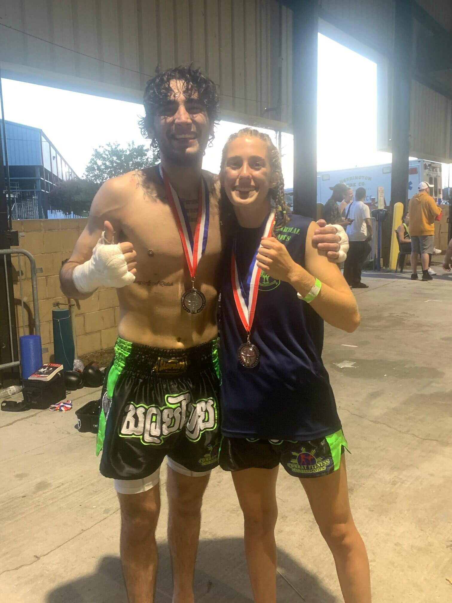 Two kickboxers happy at match